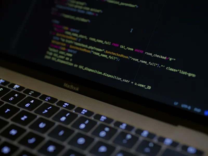 Laptop screen showing source code